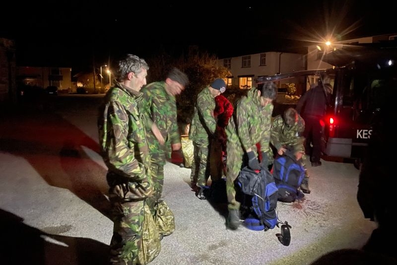Group of people at night dressed in camouflage