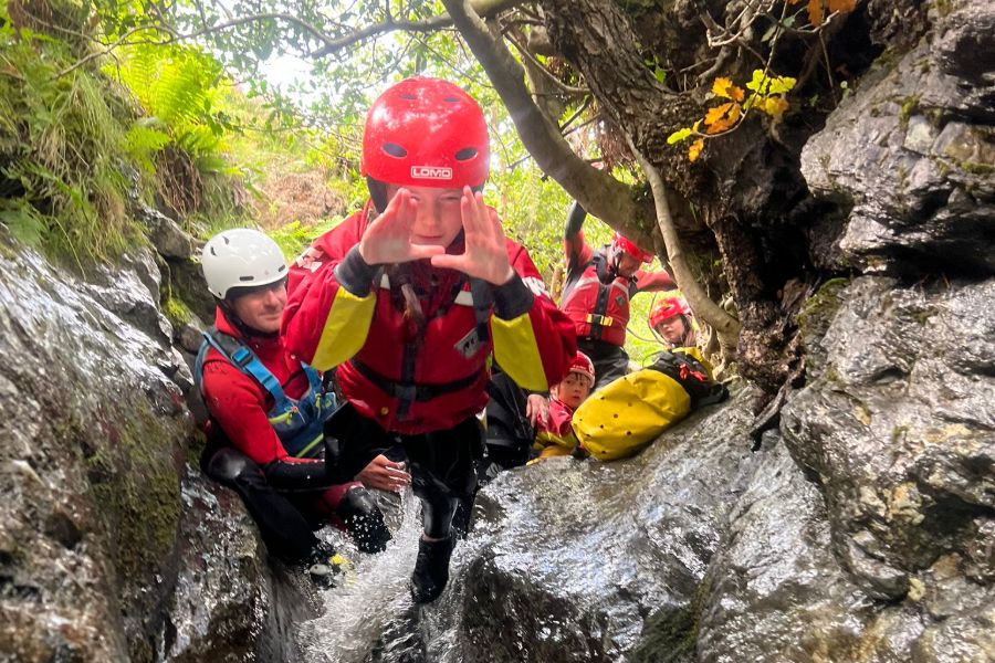 Boy jumping into a ghyll