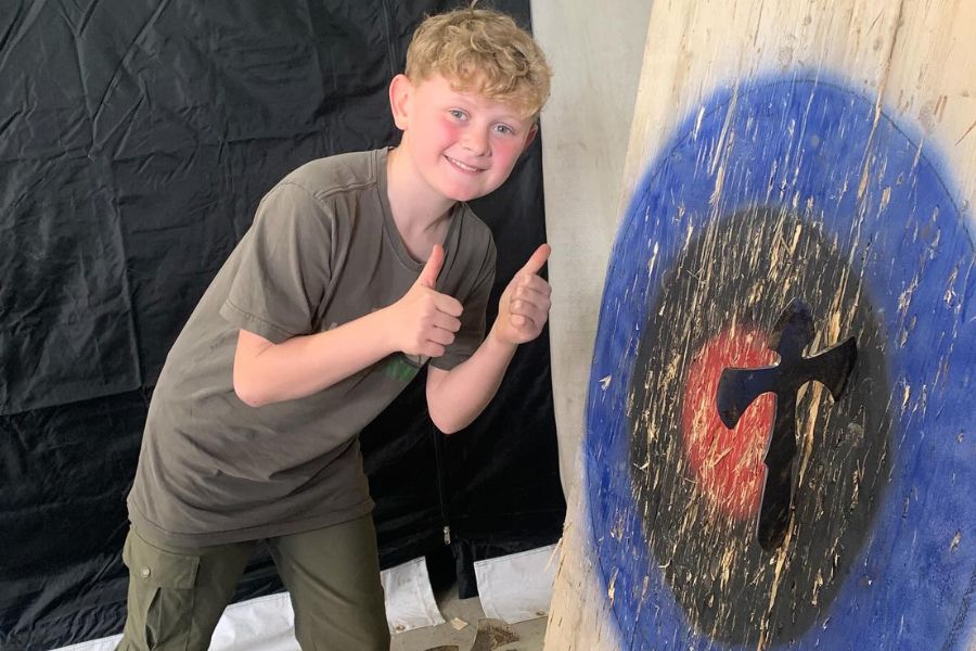 Boy axe throwing