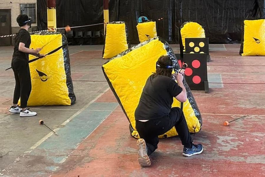 People playing battle archery