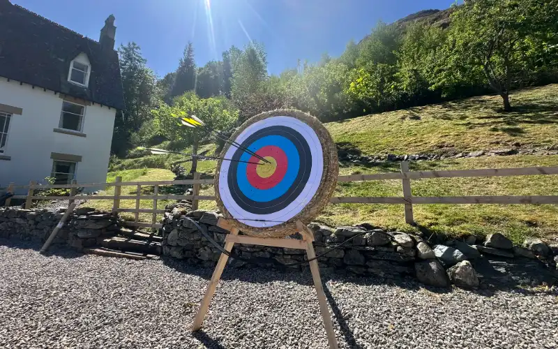 Archery target with arrows in the grounds of the Adventure House near Keswick
