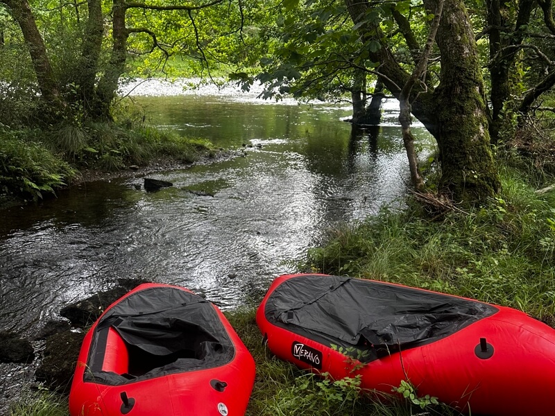 Packrafts on riverbank
