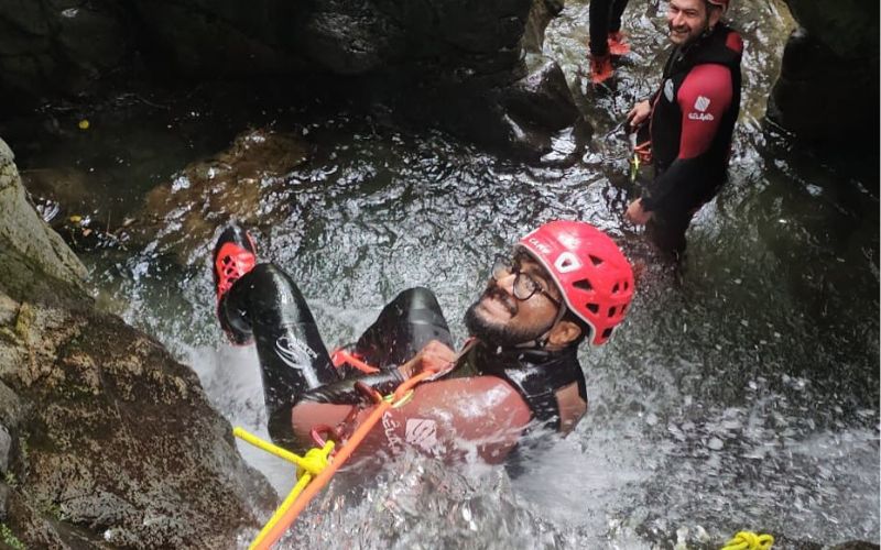 Woman packrafting in the Lake District