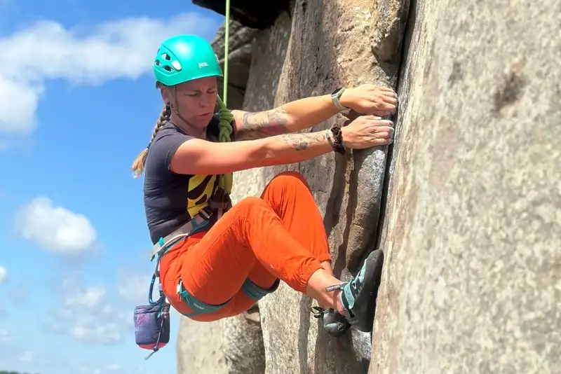 Woman rock climbing in the Lake District