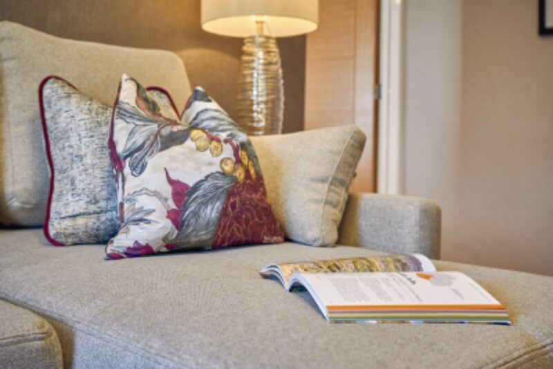 Cushion and book in a Melbreak Hotel suite