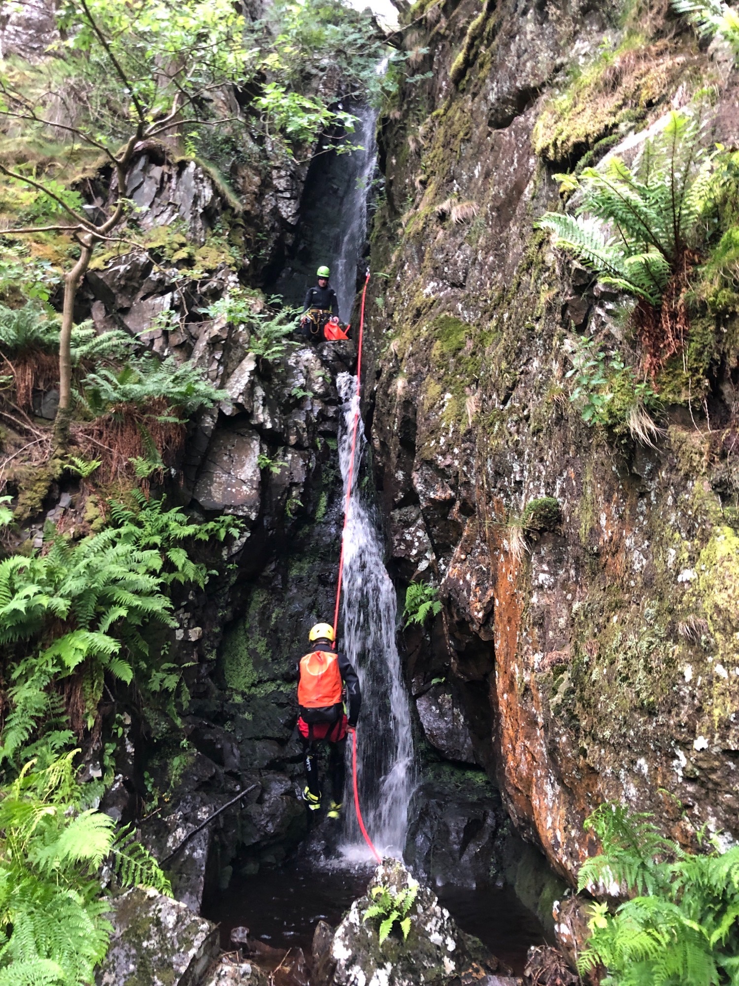 Canyoning down a waterfall in the Lake District