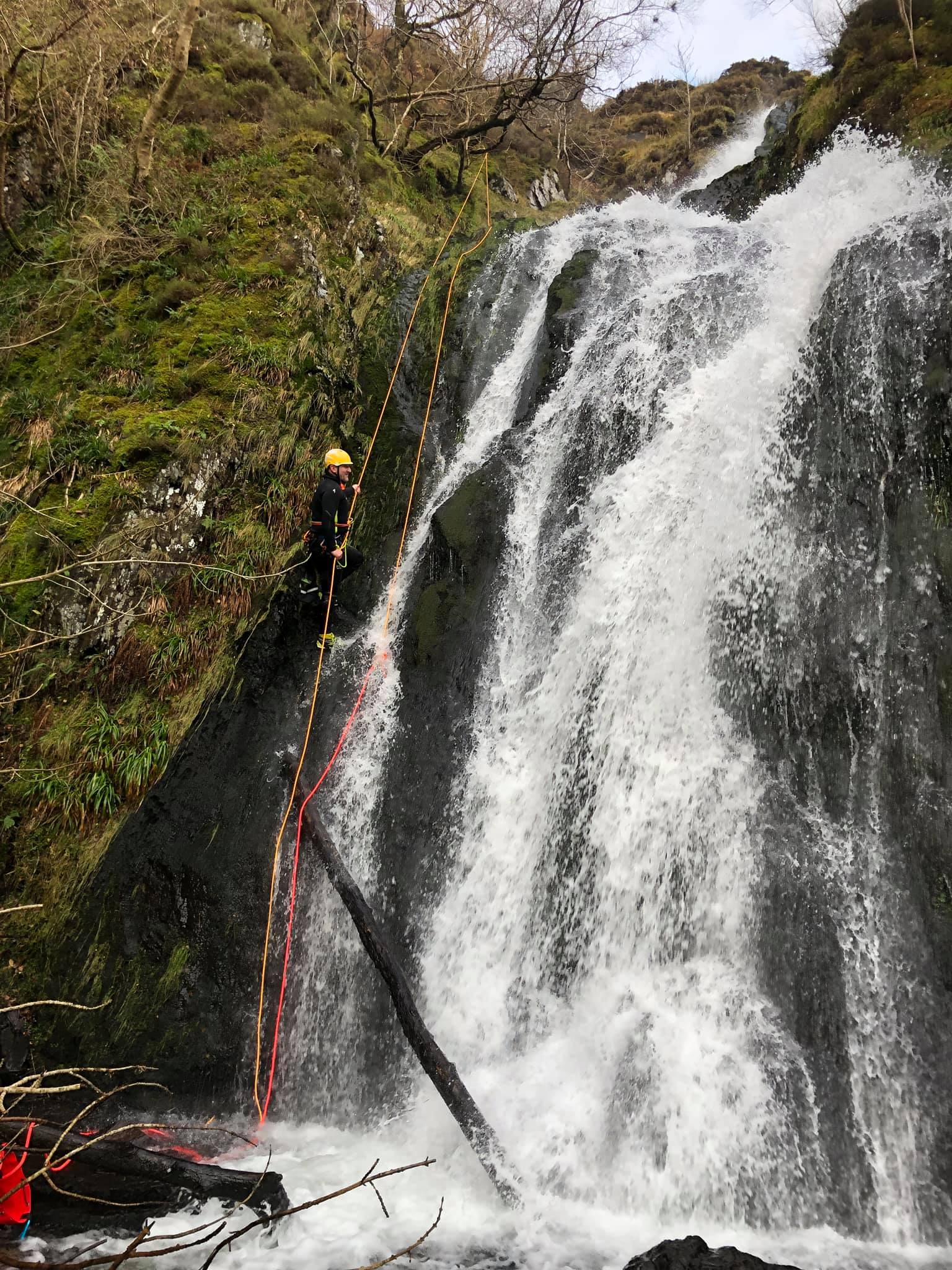 Lee Simpson abseiling down a waterfall