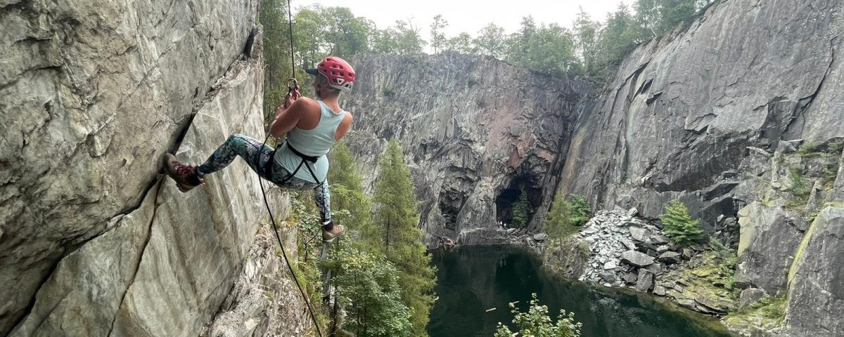 Woman climbing at Hodge Close Quarry in the Lake District