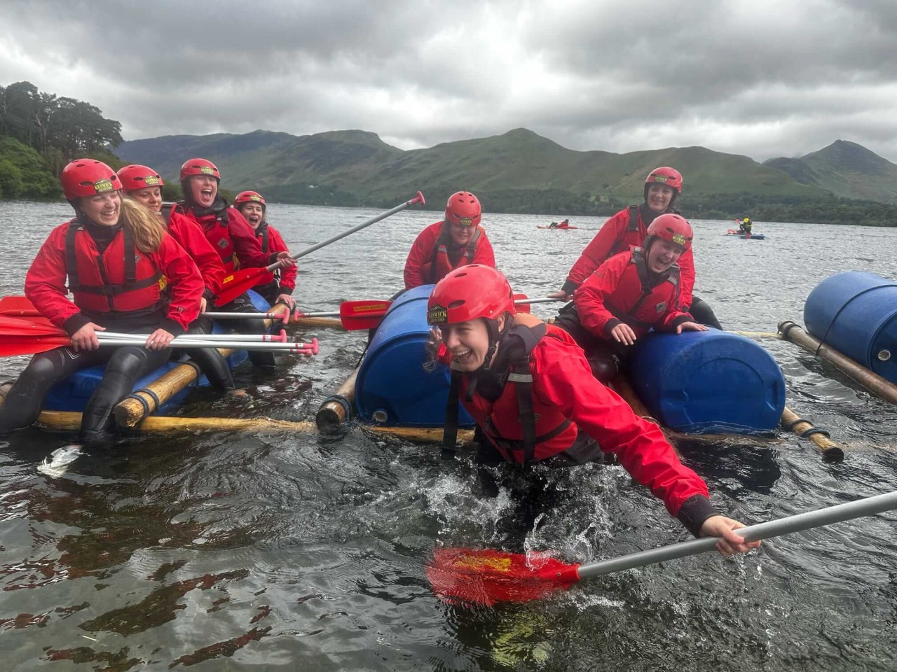Women laughing after someone fell off a raft on Derwentwater